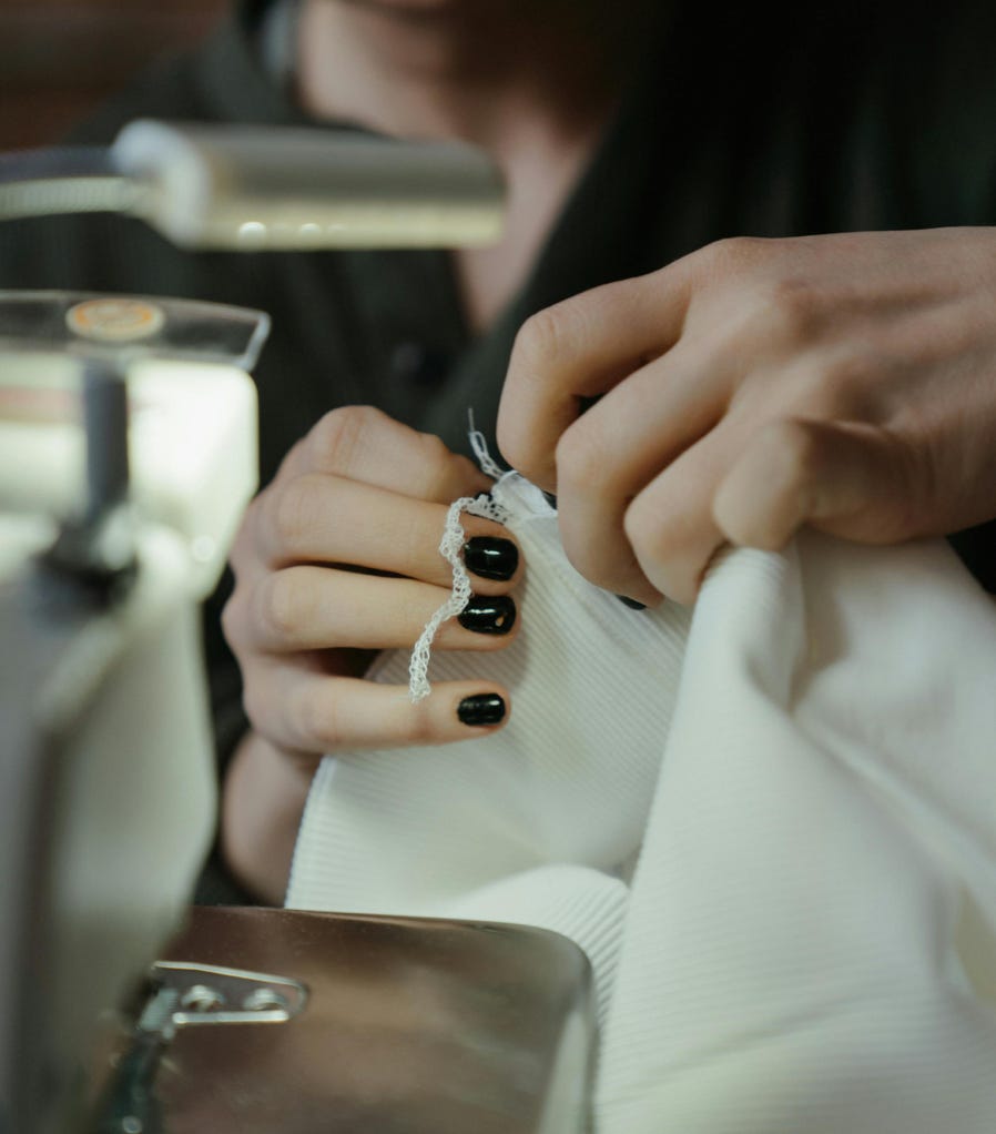 Person Holding Silver and Black Ring